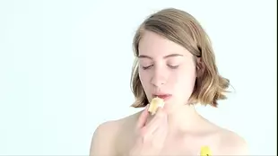 Teen blonde gets a messy feeding with a banana