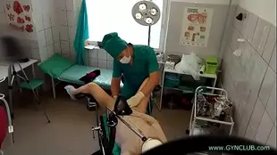 The beautiful patient is given over to the expert gynecologist