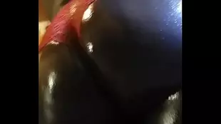 Big assed black slut gets oiled and fucked down on the phone
