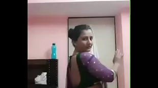 Watch a young Indian woman's buttocks receive attention in a provocative dance