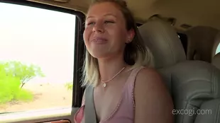A naughty blonde has fun in a heated car ride with cowgirl and oral sex