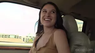 A captivating black woman entices in a car ride video