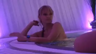 A young white girl performs oral sex in a swimming pool