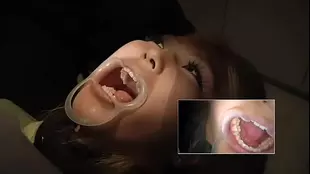 Asian dentist gives a sensual dental check-up
