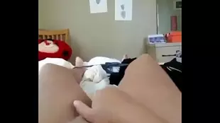 American teen moans in pleasure and reaches orgasm with fingers