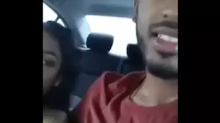 A cheating wife gives her lover a rough blowjob in a car