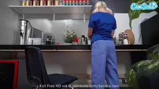 A blonde barista satisfies herself on camera during her shift