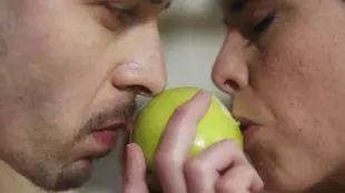 Lemon and Parker Marx share a romantic moment in the orchard