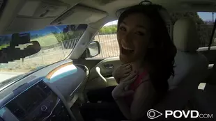 Holly Michaels gives a passionate blowjob in a car