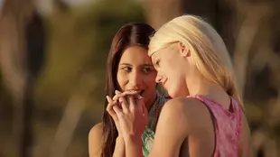 Two gorgeous blondes share a steamy lesbian encounter in this video