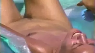Two women have a steamy poolside rendezvous